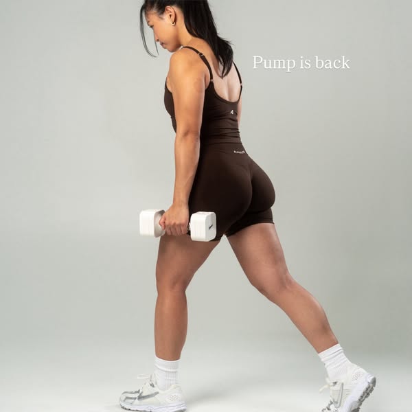 This ad features a woman in workout clothes doing a lunge while holding a dumbbell. The ad is promoting workout clothes.