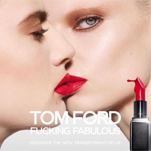 An advertisement for TOM FORD FUCKING FABULOUS lipstick. The ad features a close-up of two women whose lips touch, and a