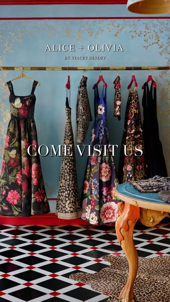 This ad for Alice + Olivia features a clothing rack of dresses in a retail store setting, inviting customers to visit th