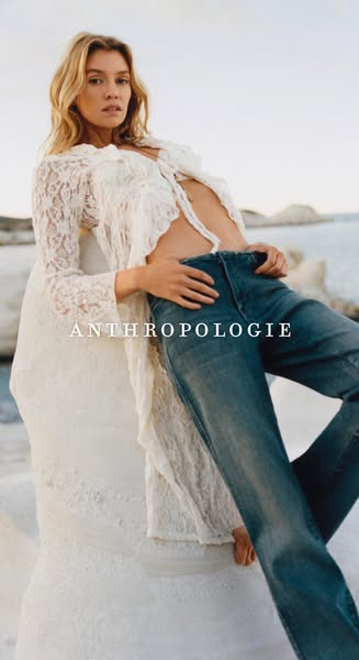 This ad showcases Anthropologie apparel, including a lacy blouse and jeans, in a lifestyle-focused shot. The image aims 