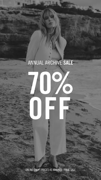 This image ad showcases a black and white image of a woman standing on the beach, wearing clothing, and promoting an ann