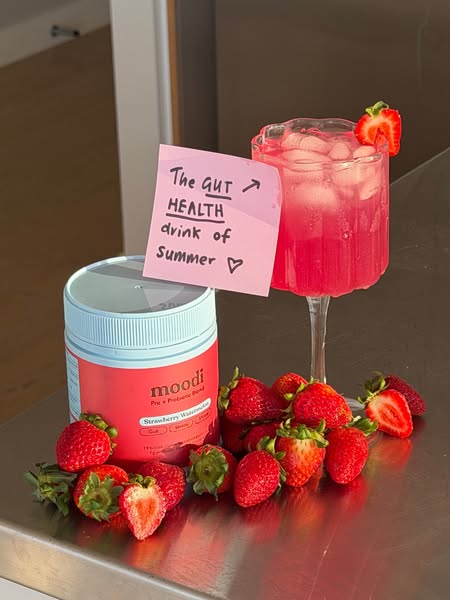 This image ad promotes moodi's Strawberry Watermelon Pro + Prebiotic Blend as the perfect gut health drink of summer
