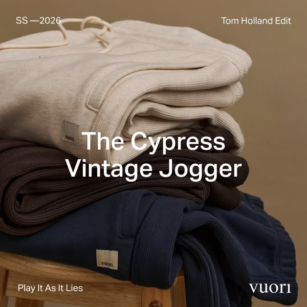 This ad for Vuori features a stack of The Cypress Vintage Jogger pants in three different colors, with the tagline “Play