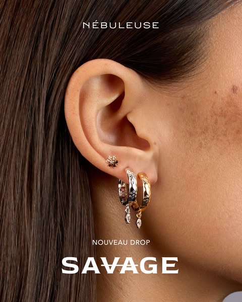 A close-up image showcasing a variety of earrings from NéBULEUSE's new 'SAVAGE' drop, emphasizing the intric