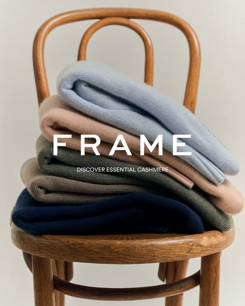This image ad features a neatly folded stack of cashmere sweaters on a wooden chair. The ad aims to highlight the essent