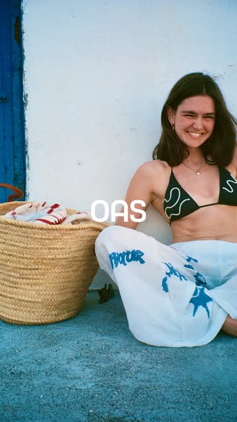 This image ad features a young woman in a relaxed, outdoor setting, smiling at the camera. She's wearing a bikini to