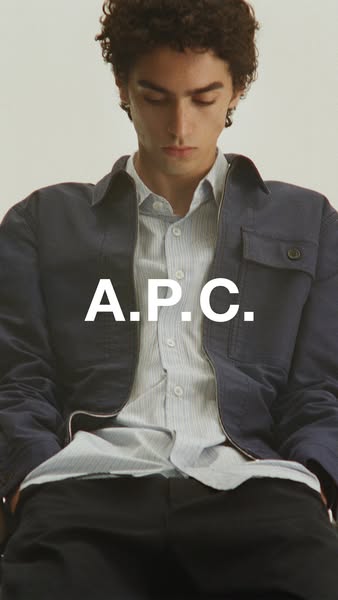 This ad features a man in a button-up shirt and jacket in front of a neutral background. The brand name is prominently d