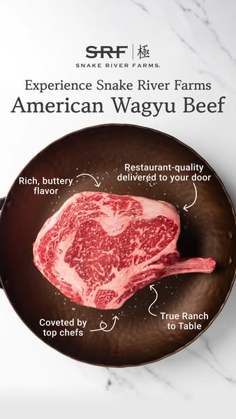 This ad features a close-up image of Snake River Farms American Wagyu Beef, specifically a ribeye steak, placed in a dar