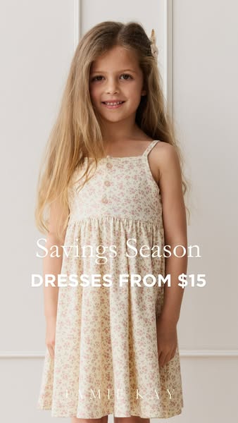 This ad showcases a young girl wearing a floral dress from Jamie Kay, highlighting the brand and the availability of dre