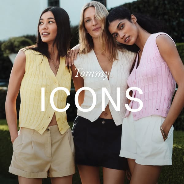 The image ad for Tommy Hilfiger clothing features three models wearing cardigans and shorts. The ad emphasizes the brand