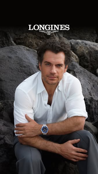 This image ad for Longines features actor Henry Cavill wearing a Longines watch. The ad emphasizes the brand's elega
