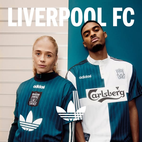 This ad features two people wearing Liverpool Football Club apparel by Adidas. The background is split in half with whit