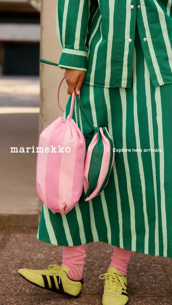 This ad features an up-close lifestyle shot of a person carrying the Marimekko drawstring bag. The overall style is brig