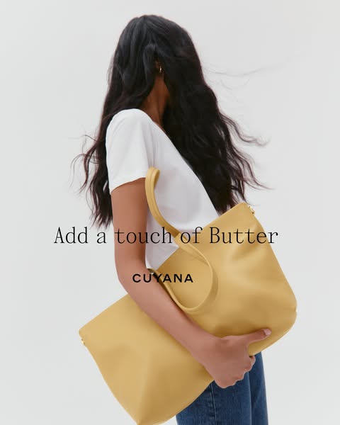 This image features a woman wearing a Cuyana tote bag. The main copy in the image is "Add a touch of Butter".