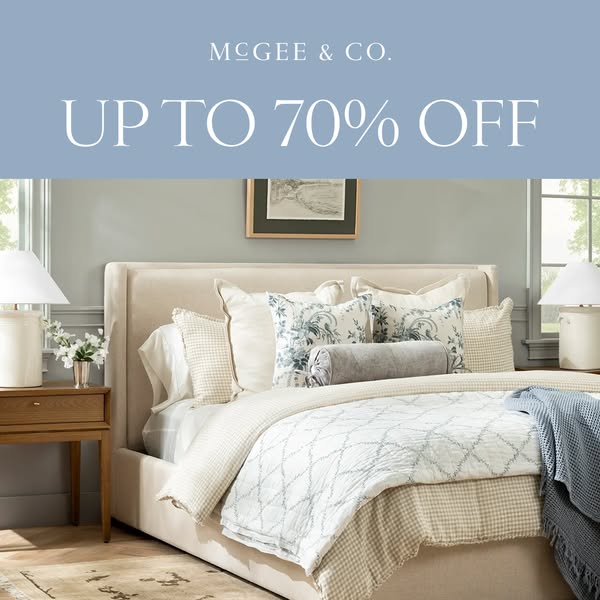 This image ad from McGee & Co. features a bedroom scene with luxury bedding and decor, highlighting a sale of up to 