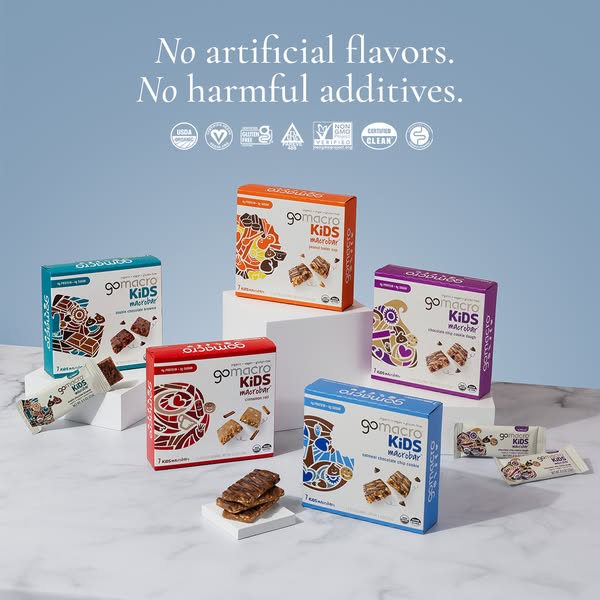 This ad promotes GoMacro KIDS macrobars as a healthy and convenient snack option. The ad emphasizes the absence of artif