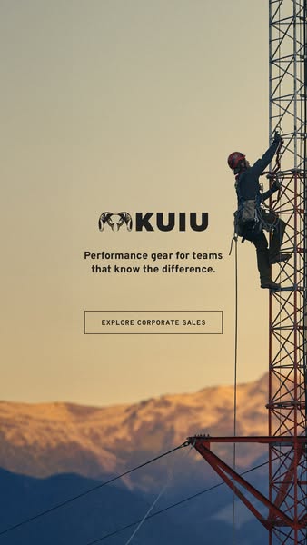 This ad for KUIU features a man climbing a radio tower, highlighting the brand's performance gear designed for teams