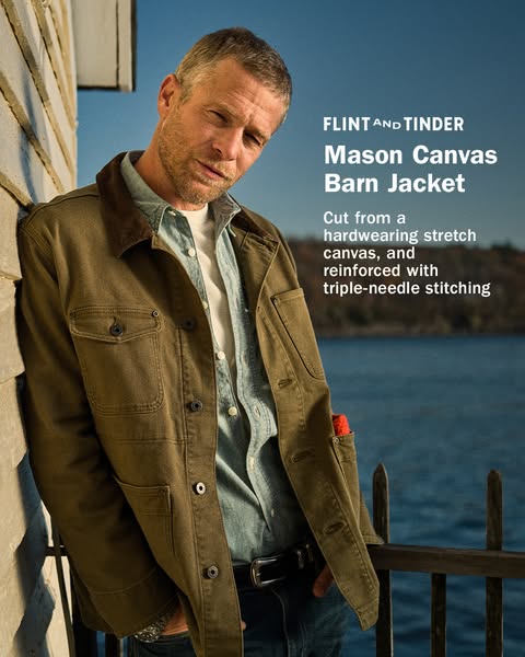 This ad showcases the Mason Canvas Barn Jacket from Flint and Tinder, highlighting its durable construction and stylish 