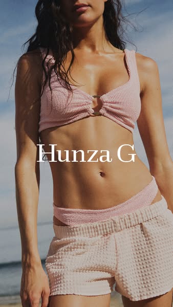 An image of a person modeling a Hunza G swimsuit, overlaid with the brand name.