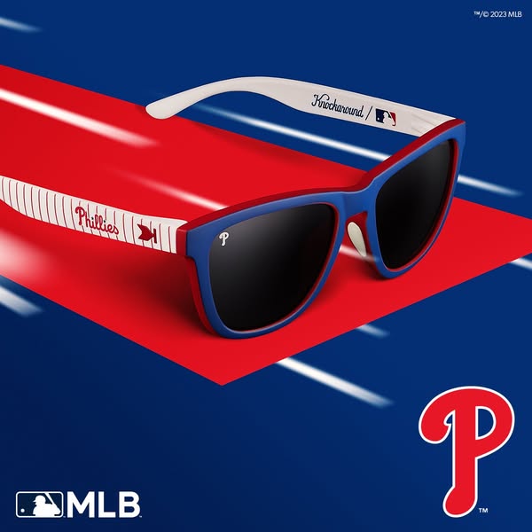 This image ad showcases Knockaround sunglasses branded in the style of the Philadelphia Phillies MLB team. The shot feat