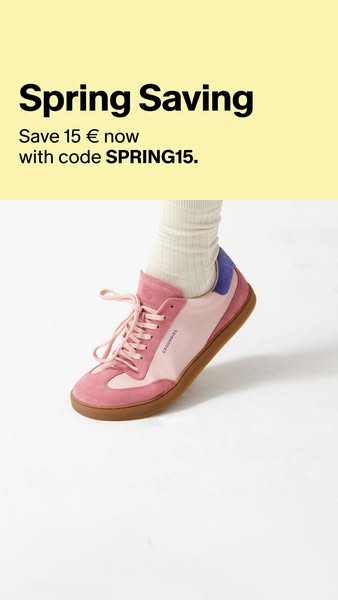 This ad features a close-up shot of a pink and tan sneaker being worn with a ribbed sock. A promotional offer appears in