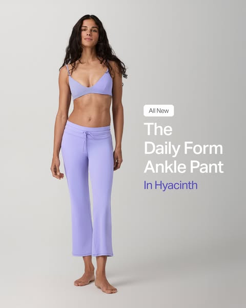 An image ad showcasing 'The Daily Form Ankle Pant' in Hyacinth, featuring a woman wearing the pants with a match