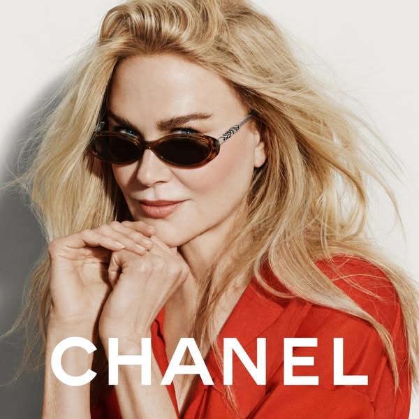 This ad features an image of Nicole Kidman wearing Chanel sunglasses. The Chanel brand name is shown in a large font at 
