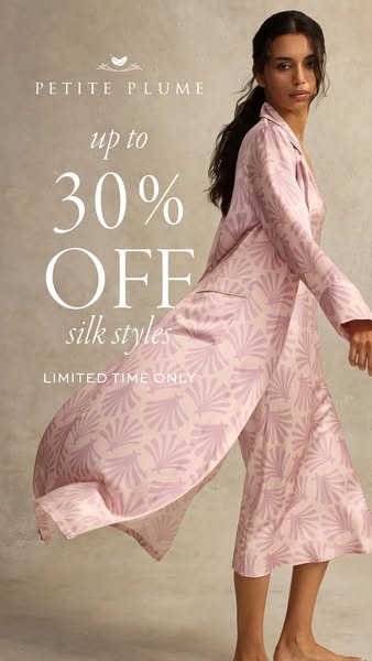 This ad for Petite Plume features a model wearing silk pajamas and a matching robe. Text overlaid on the image advertise