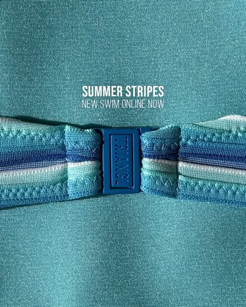 This image ad promotes TRIANGL's new line of striped swimwear available online now. The ad features a close-up shot