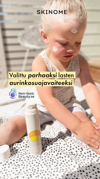 The image ad features a young child sitting outside with sunscreen being applied to their face. The ad highlights the su
