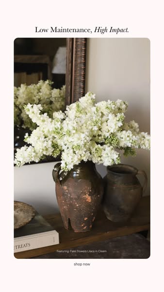 This ad features a serene photo of fake white lilacs in cream-colored pottery to promote the visual impact and low maint