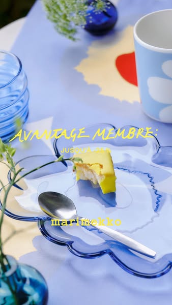 This ad features a slice of lemon cake on a Marimekko plate, displayed on a Marimekko tablecloth. Text promotes Marimekk