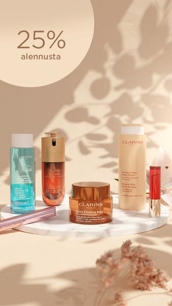 This ad for Clarins features a selection of the brand's skincare and makeup products on a marble surface, set agains