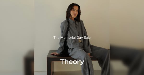 This ad features a model wearing a Theory brand linen suit while sitting on a table. The text overlay promotes Theory