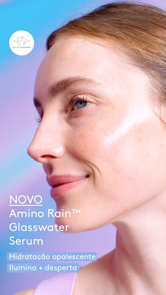This image ad showcases the Drunk Elephant Amino Rain Glasswater Serum, highlighting its hydrating and illuminating prop