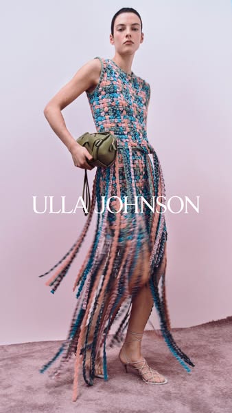 The ad features a woman modeling an Ulla Johnson dress and bag against a pink background. The focus is on showcasing the