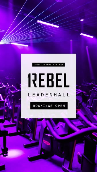 This is an image ad for the grand opening of a gym. The ad features rows of stationary bikes and laser lights, and the t