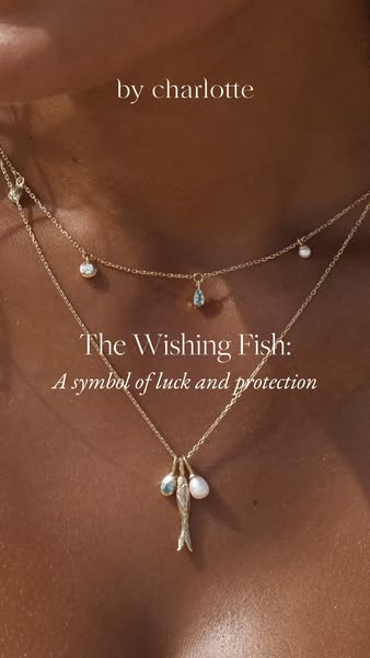 This image ad showcases a layered gold necklace with unique gemstone and pearl charms. It emphasizes the brand's foc