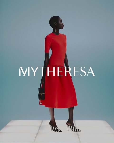 An ad for Mytheresa featuring a woman in a red dress, black purse and zebra-print shoes.