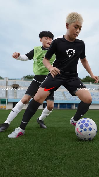This ad features two young soccer players wearing Nike gear on the field and kicking a soccer ball. It is advertising a 