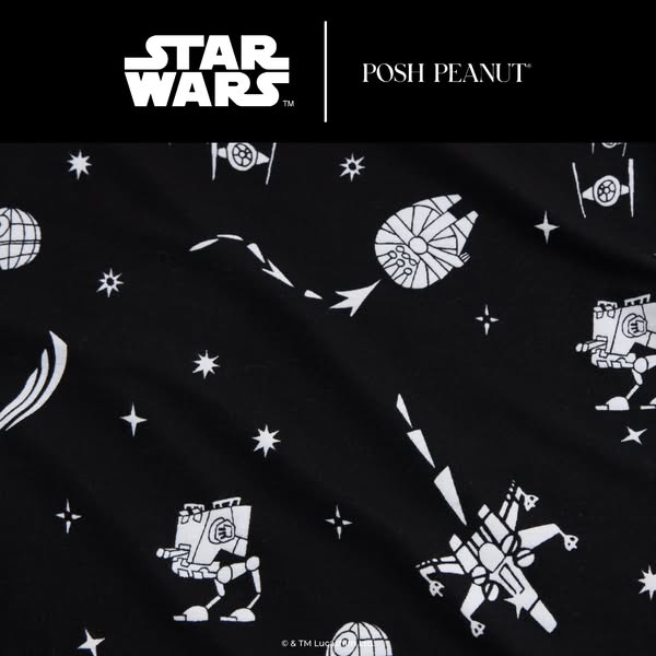 This image ad showcases a black fabric or textile featuring a repeating pattern of white Star Wars spacecrafts and starb