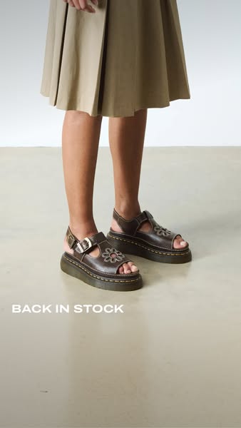 This ad displays the product from a low angle, displaying the full shoe along with the lower half of the body of the per