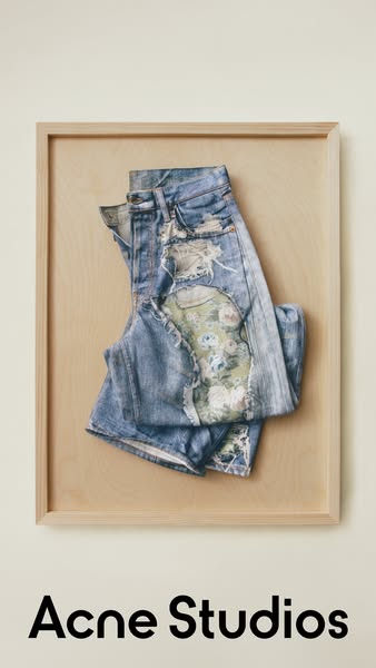 This ad features a pair of distressed Acne Studios jeans presented in a framed wooden panel for an artistic and visually