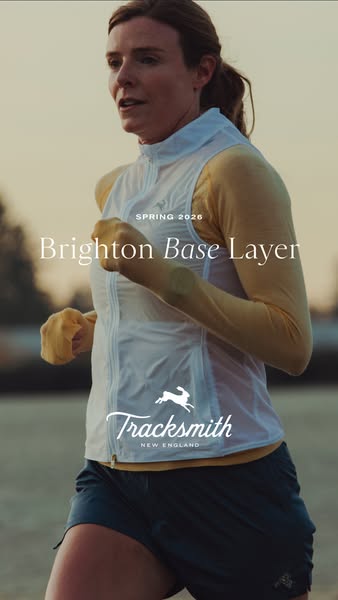This ad features a woman running outdoors wearing Tracksmith apparel. The ad focuses on the Brighton Base Layer, highlig