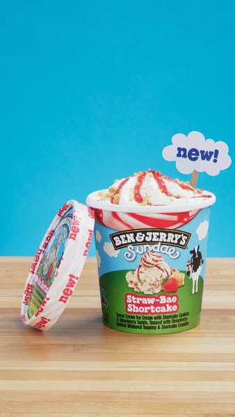 This ad features a Ben & Jerry's ice cream sundae cup, highlighting the new 'Straw-Bae Shortcake' flavor