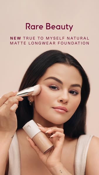 An advertisement for Rare Beauty's new True to Myself Natural Matte Longwear Foundation. The ad features Selena Gome