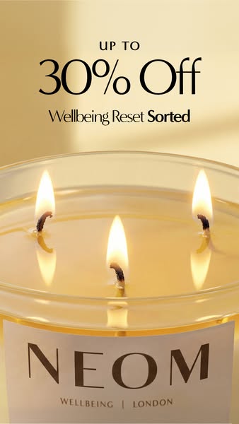 A close up shot of a candle with a discount for up to 30% off.