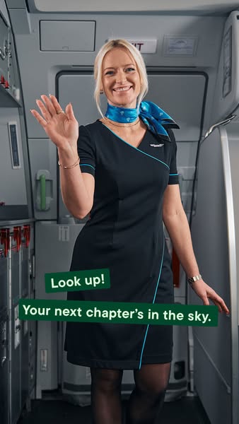 This ad features a smiling flight attendant in an airplane doorway, inviting viewers to 'look up' and consider a