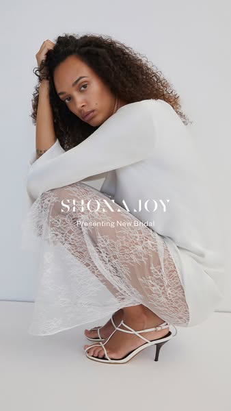 This ad for Shona Joy features a woman wearing a white bridal dress and strappy heels, promoting the brand's new bri