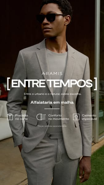 This image ad for Aramis displays a man wearing a light gray suit and a gray t-shirt, along with dark sunglasses. The te
